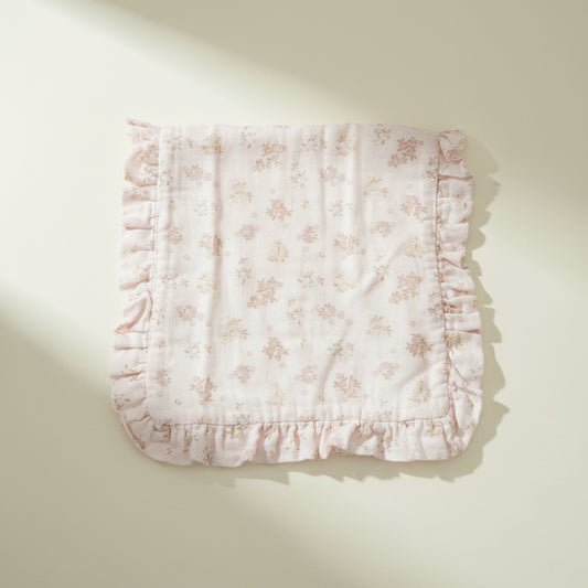 Floral-patterned burp cloth with ruffled edges
