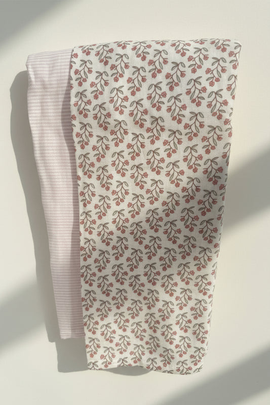 2 baby blanket set with floral and striped design.