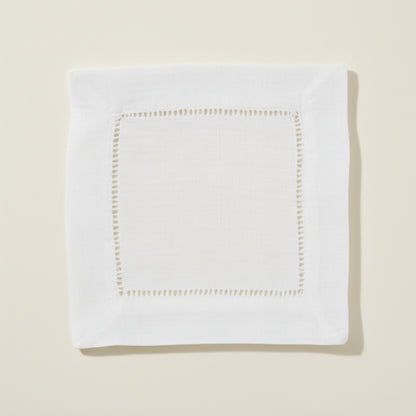 White hemstitch cocktail napkin on a white background