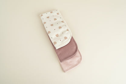 Set of three burp cloths with different colors and patterns.