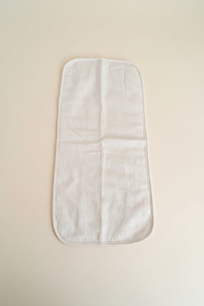 Light beige baby burp cloth.