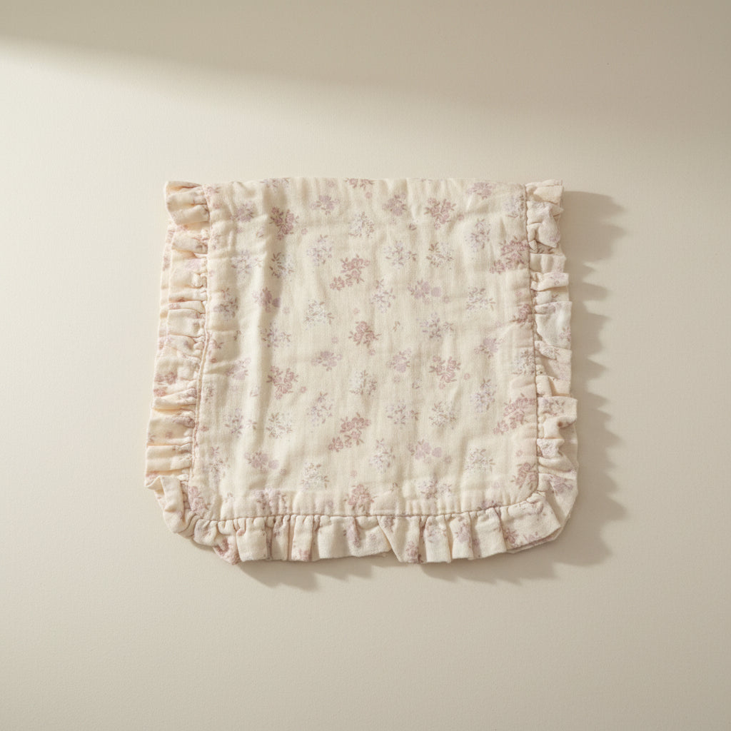 Floral-patterned burp cloth with ruffled edges