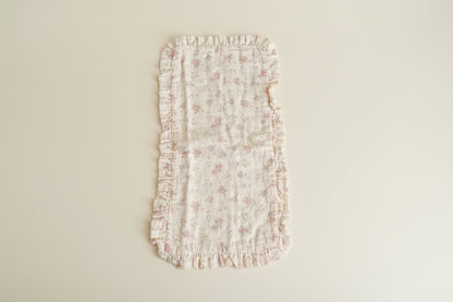 Floral-patterned burp cloth with ruffled edges