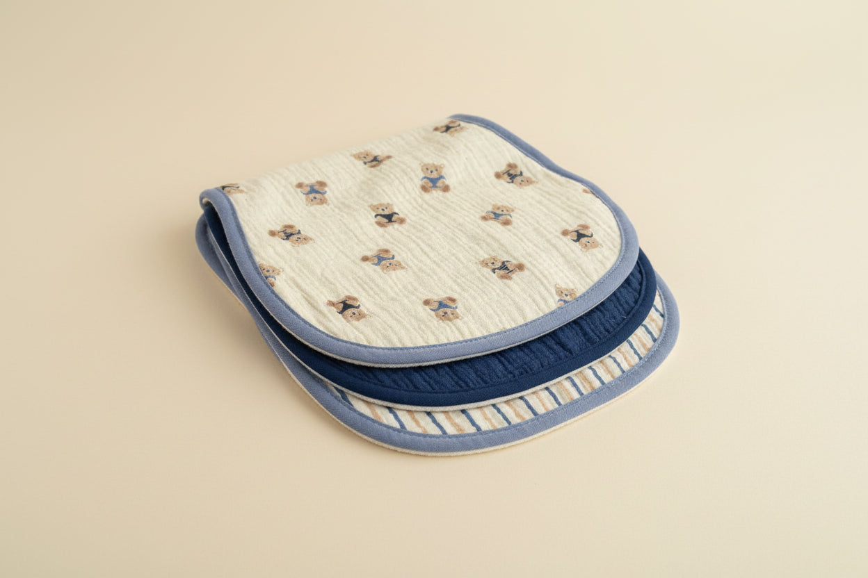 Three burp cloths with different patterns