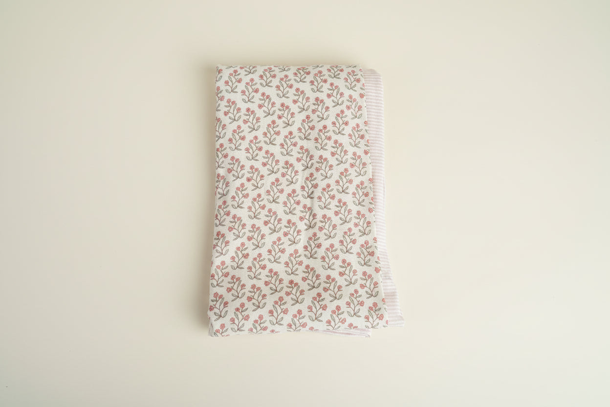 2 baby blanket set with floral and striped design.
