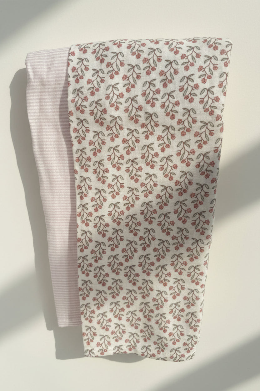 2 baby blanket set with floral and striped design.