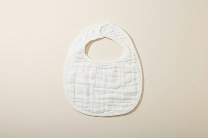 White bib on a beige surface