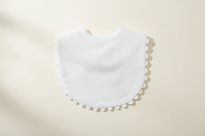 White bib on a wooden surface