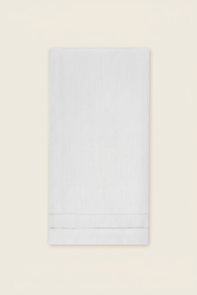 White napkin with hemstitching on a white background