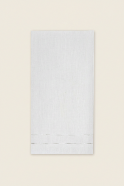 White napkin with hemstitching on a white background