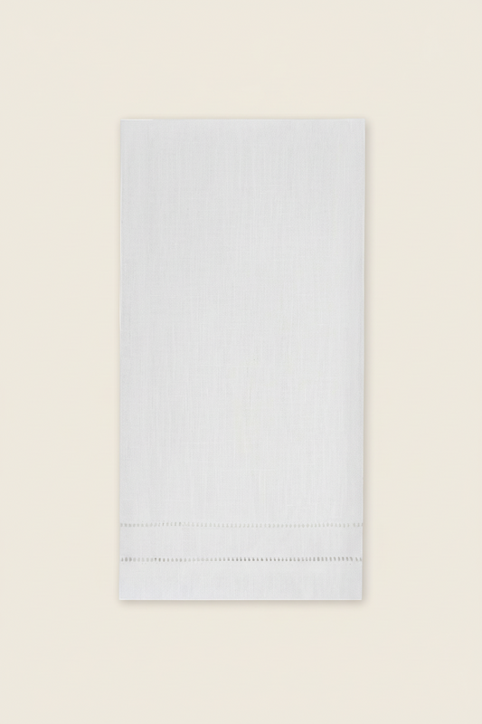 White napkin with hemstitching on a white background