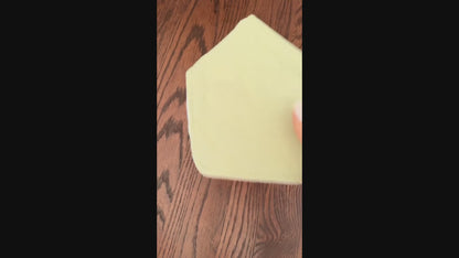 video set of 5 of colorful baby bibs on a wooden surface