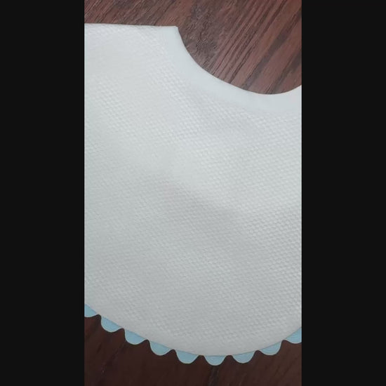 white with blue ric rac trim bib